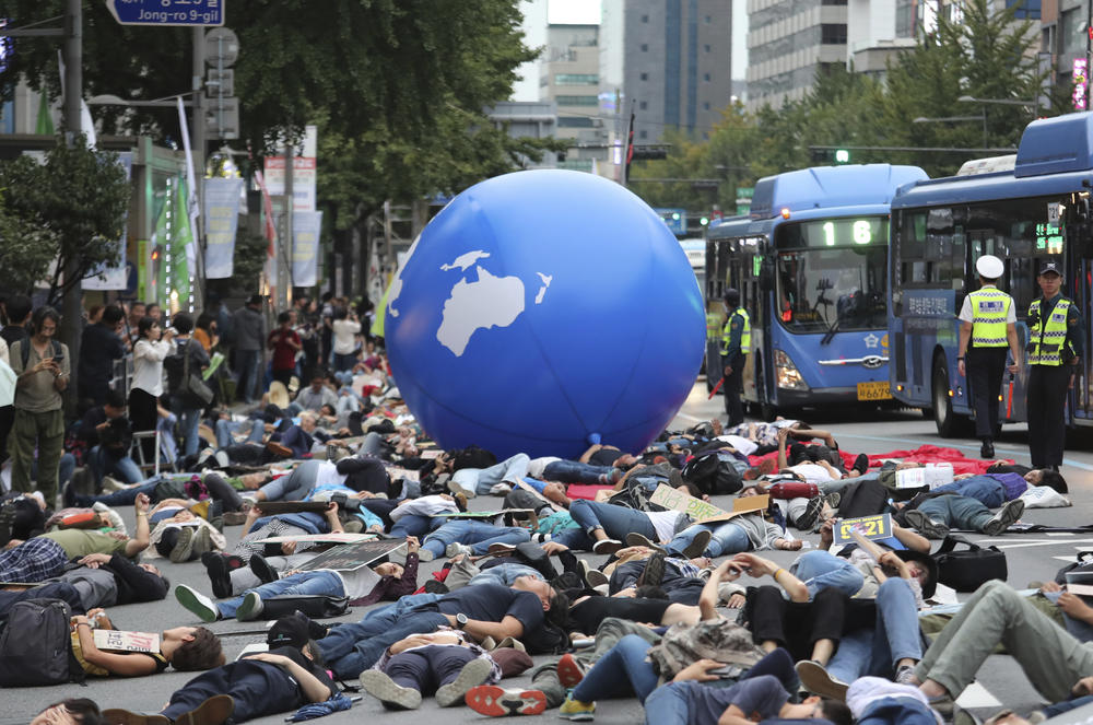 In this Saturday, Sept. 21, 2019 file photo, environmental activists stage a rally demanding action in stopping the climate crisis in Seoul, South Korea. The world's younger generations have become a vocal force in the debate over global warming.