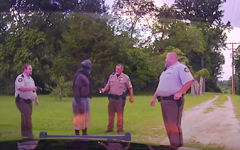 A frame from dashboard video recorded by Washington County Sheriff's Deputies moments before they electrocuted Eurie Lee Martin, center, to death in 2017. 