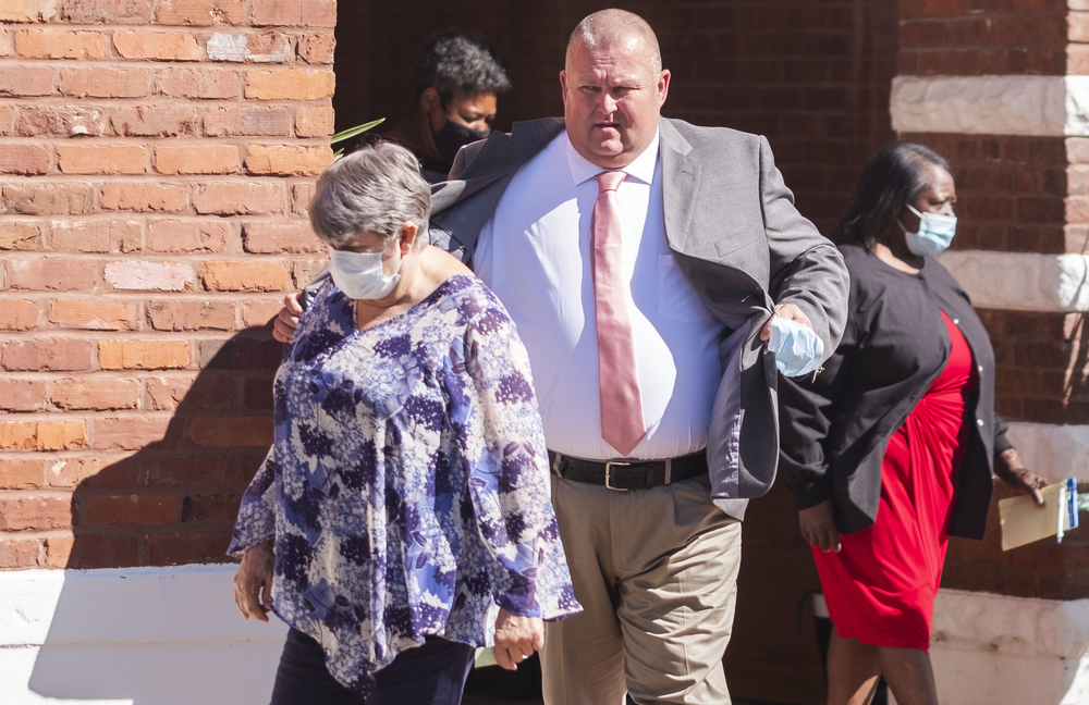 Former Washington County Sheriff's Deputy Michael Howell leaves court Wednesday followed by Helen Gilbert, right, the sister of Eurie Martin, the man Howell and co-defendants Rhett Scott and Henry Copeland are accused of murdering in 2017.
