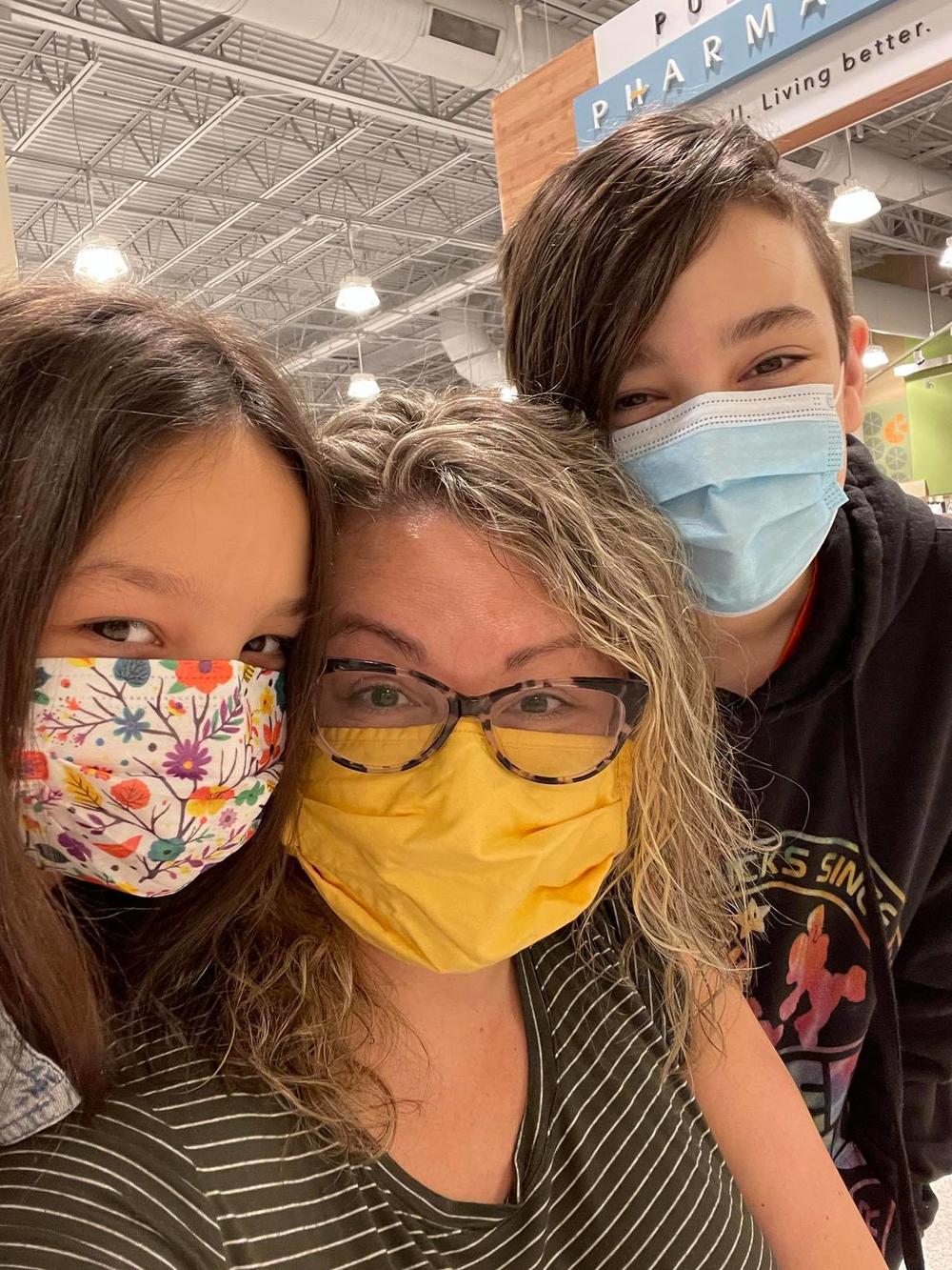 Emma and Joshua Wicker hug their mom right after she received her second dose of Moderna’s COVID vaccine April 13, 2021.