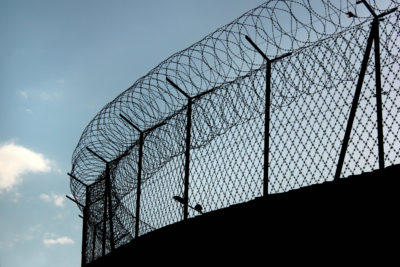 Prison fence with razor wire