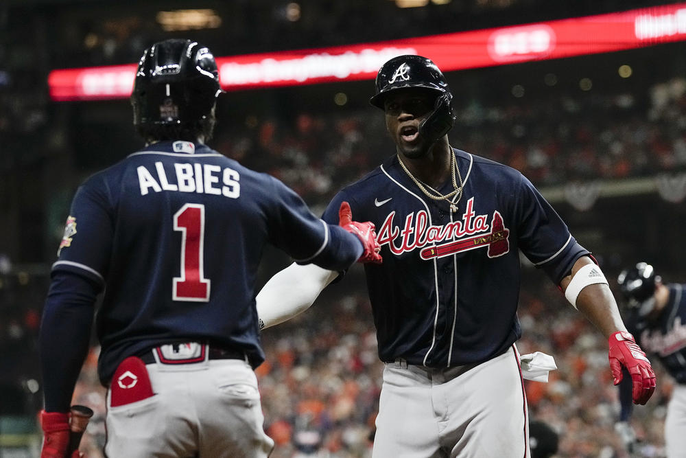 Atlanta Braves' Jorge Soler celebrates with Ozzie Albies after a home run during the first inning of Game 1 in baseball's World Series between the Houston Astros and the Atlanta Braves Tuesday, Oct. 26, 2021, in Houston.