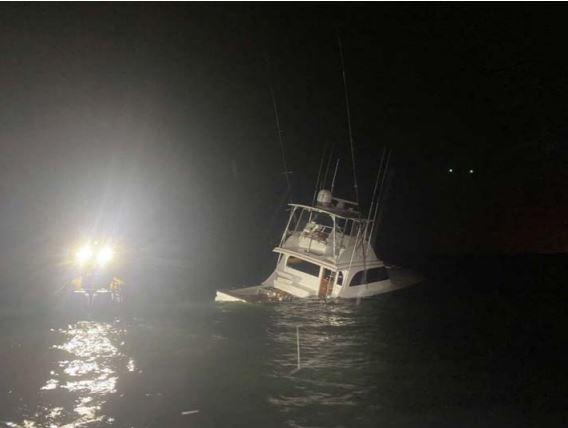 After accidentally striking a right whale, the captain of the “About Time” intentionally grounded the sinking sportfishing boat’ in Salt Run on Anastasia Island within the State Park. 