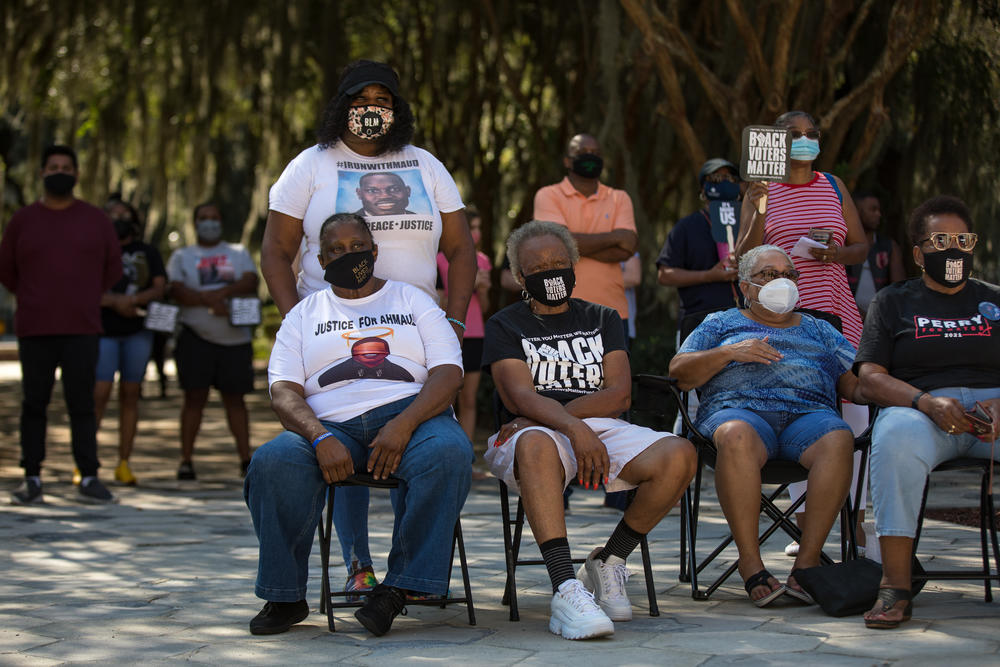 Supporters of Ahmaud Arbery gather at Glynn County Courthouse on Oct. 16, 2021, ahead of the trial of three men accused in his killing.