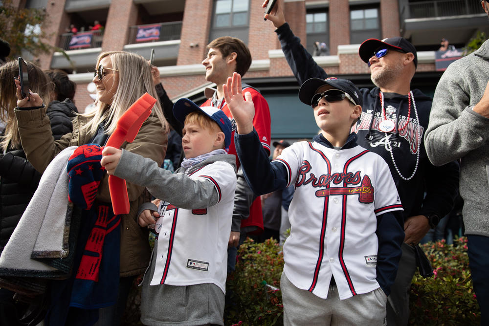 Young fans celebrate as Braves players pass by during the teams’ victory parade in Cobb County on Nov. 5.