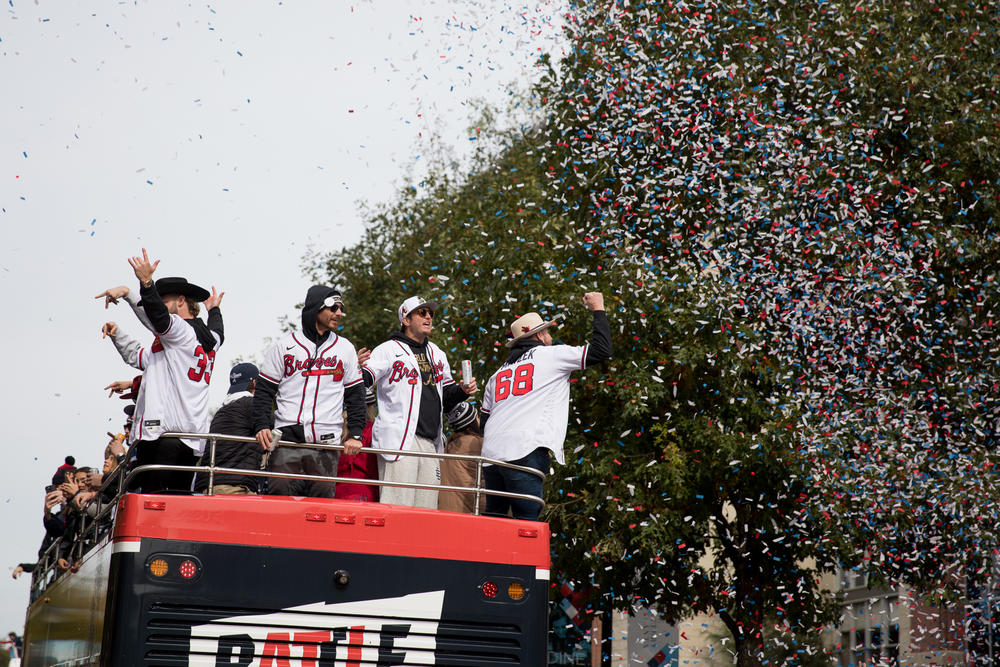 Atlanta Braves players celebrate under a shower of confetti as they travel through The Battery outside Truist Park during their victory parade on Nov. 5.
