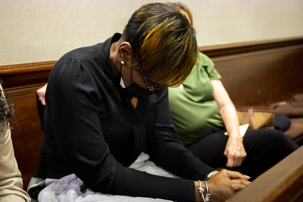 Ahmaud Arbery's mother Wanda Cooper-Jones reacts to autopsy photos entered into evidence during the trial of Greg McMichael and his son, Travis McMichael, and a neighbor, William "Roddie" Bryan in the Glynn County Courthouse, Tuesday, Nov. 16, 2021, in Brunswick, Ga.