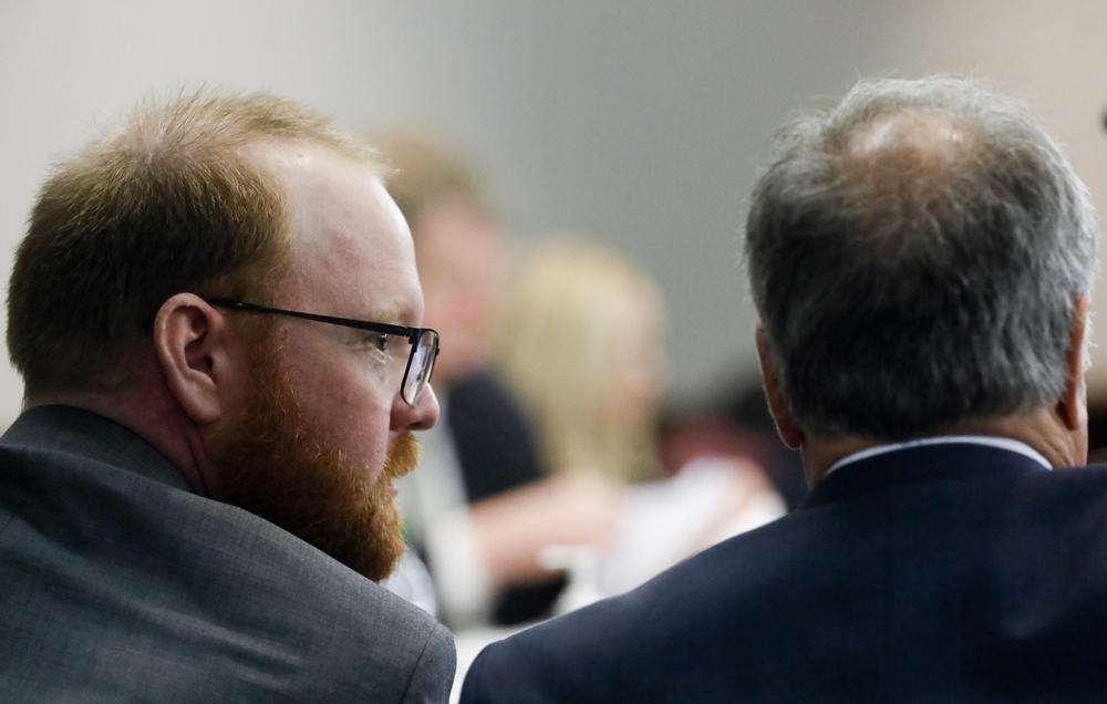 Defendant Travis McMichael sits next to defense attorney Robert Rubin, during his trial at the Glynn County Courthouse, Friday, Nov. 19, 2021, in Brunswick, Ga.