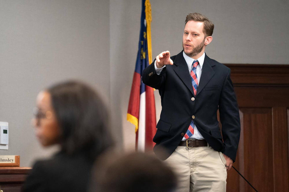 Former Glynn County police officer Ricky Minshew points out defendant Travis McMichael during the trial for Ahmaud Arberys shooting death at the Glynn County Courthouse on November 8, 2021 in Brunswick, Georgia.