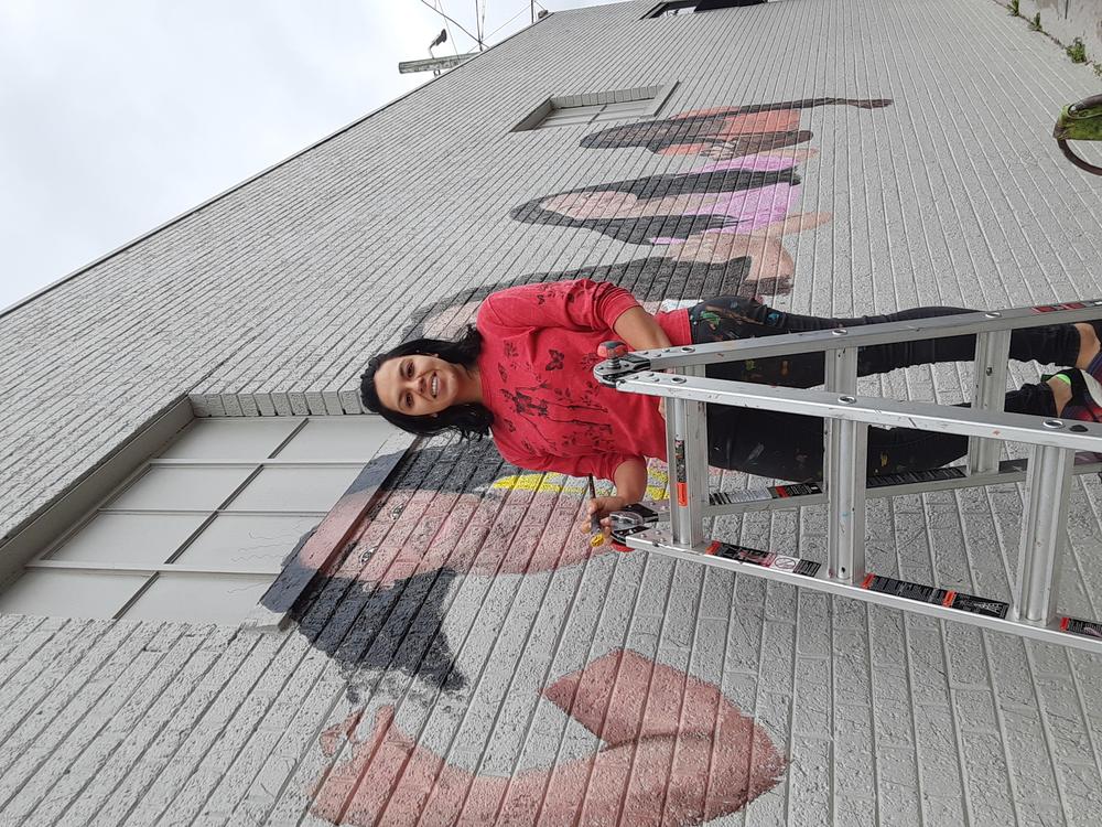 Artist Mayelli Meza was told the mural ought to represent Dalton, diversity, “who we are, where we came from and where we’re going,” so she produced a “rough sketch in watercolor” focusing on seven local girls.