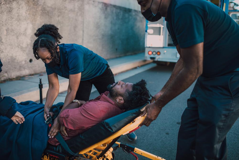 Paramedics rescuing a man.