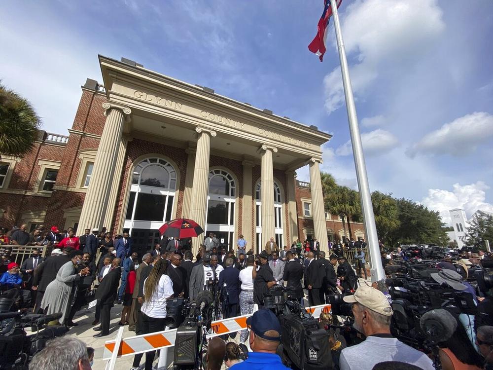 Hundreds of pastors rally during the trial of Greg McMichael and his son, Travis McMichael, and a neighbor, William "Roddie" Bryan outside the Glynn County Courthouse, Thursday, Nov. 18, 2021, in Brunswick, Ga. The three are charged with the February 2020 slaying of 25-year-old Ahmaud Arbery. 