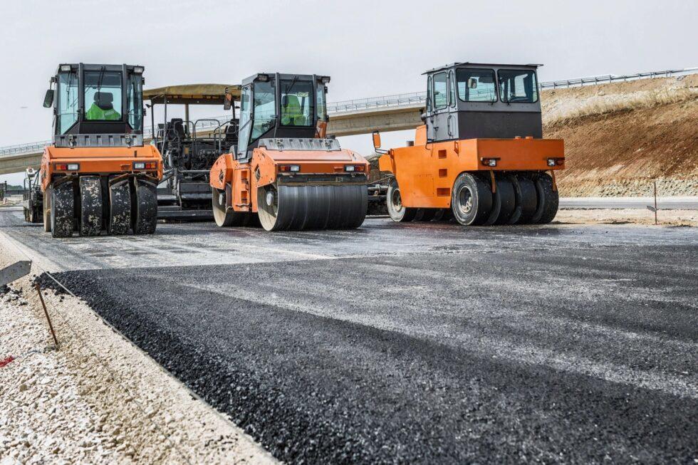 Trucks doing highway construction