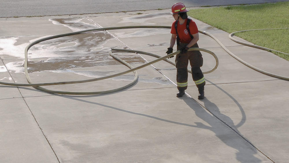 A recruit practices hose drills at the Columbus Department of Fire & EMS training facility on August 25, 2021, in Columbus, Ga.