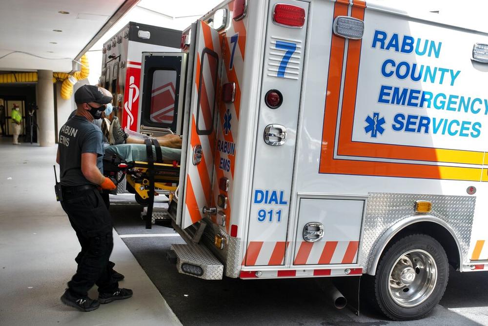 Ambulances from surrounding counties fill the emergency entrance Monday, Aug. 30, 2021, at the Northeast Georgia Medical Center Gainesville, Ga. Like most in Georgia, the hospital experienced a surge in COVID-19 patients as the state set a new mark for infections on Tuesday, Aug. 31.