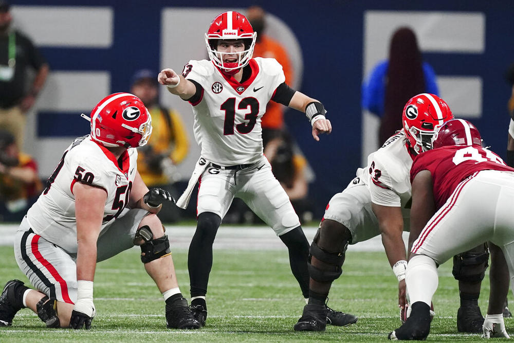 Georgia quarterback Stetson Bennett (13) calls audible against Alabama during the first half of the Southeastern Conference championship NCAA college football game, Saturday, Dec. 4, 2021, in Atlanta.