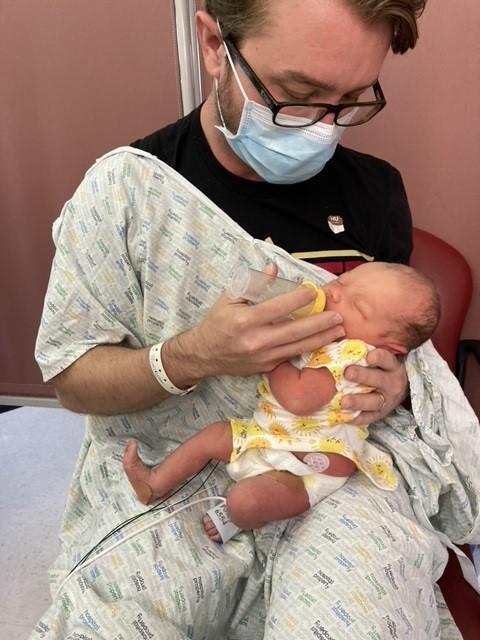 Matt McDaniel holds his newborn daughter, Delilah McDaniel