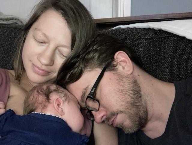 Isadora Pennington and Matt McDaniel hold their daughter Delilah McDaniel, born during the pandemic