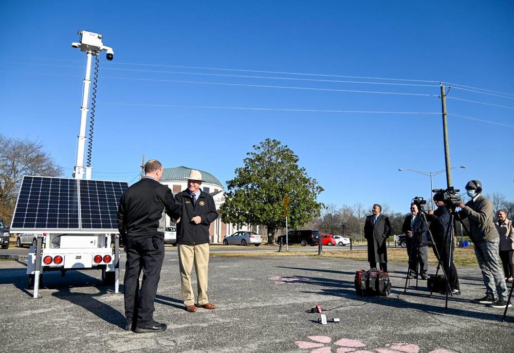 Bibb County Sheriff David Davis shakes hands with Warren Selby with the Macon Bibb Law Enforcement Foundation after the Foundation announced the purchase of a solar-powered, $26,000 portable camera. The camera which can be raised to 25 feet will be used by the Sheriff’s office to help monitor crowded events. 