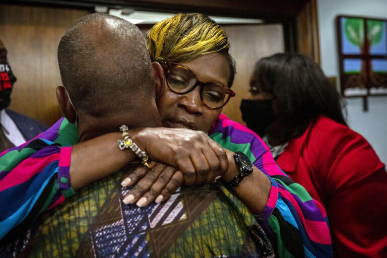  Ahmaud Arbery’s mother, Wanda Cooper-Jones, is hugged by a supporter after the jury convicted Travis McMichael in the trial of McMichael, his father, Greg McMichael, and neighbor, William “Roddie” Bryan, at Glynn County Courthouse. AP Photo/Stephen B. Morton, Pool