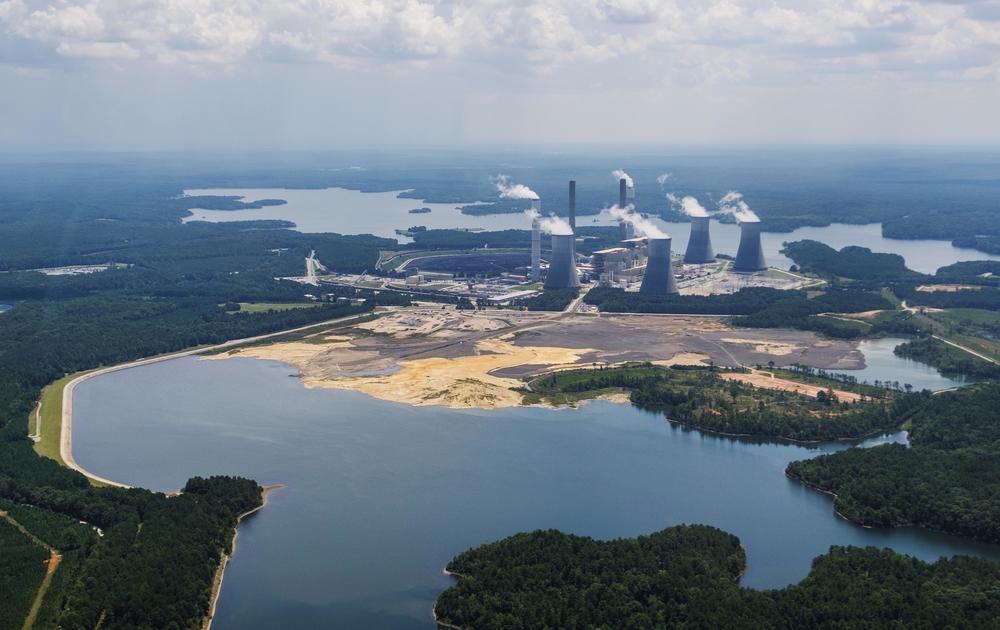 The coal ash pond, foreground, where waste from Georgia Power's coal fired Plant Scherer is stored. The EPA said it will not allow coal ash to be stored in contact with groundwater as it is now at Plant Scherer. 