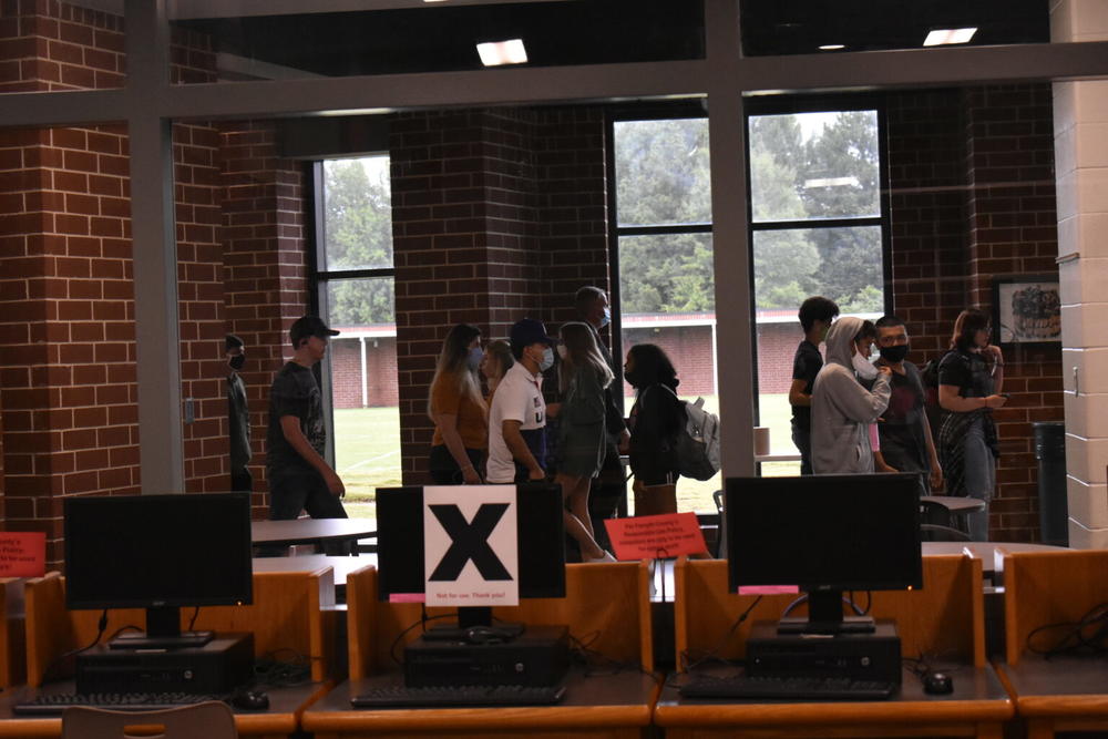 Students walk past the library at Forsyth Central High School.