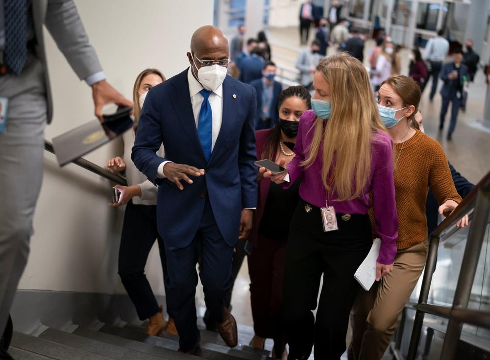 Sen. Raphael Warnock, D-Ga., arrives at the Capitol in Washington, Wednesday, Dec. 15, 2021.