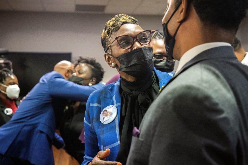 Ahmaud Arbery's mother Wanda Cooper-Jones, center, speaks with supporters after Superior Court Judge Timothy Walmsley sentenced Greg McMichael, his son, Travis McMichael, and a neighbor, William "Roddie" Bryan, Friday, Jan. 7, 2022, at the Glynn County Courthouse in Brunswick, Ga. 