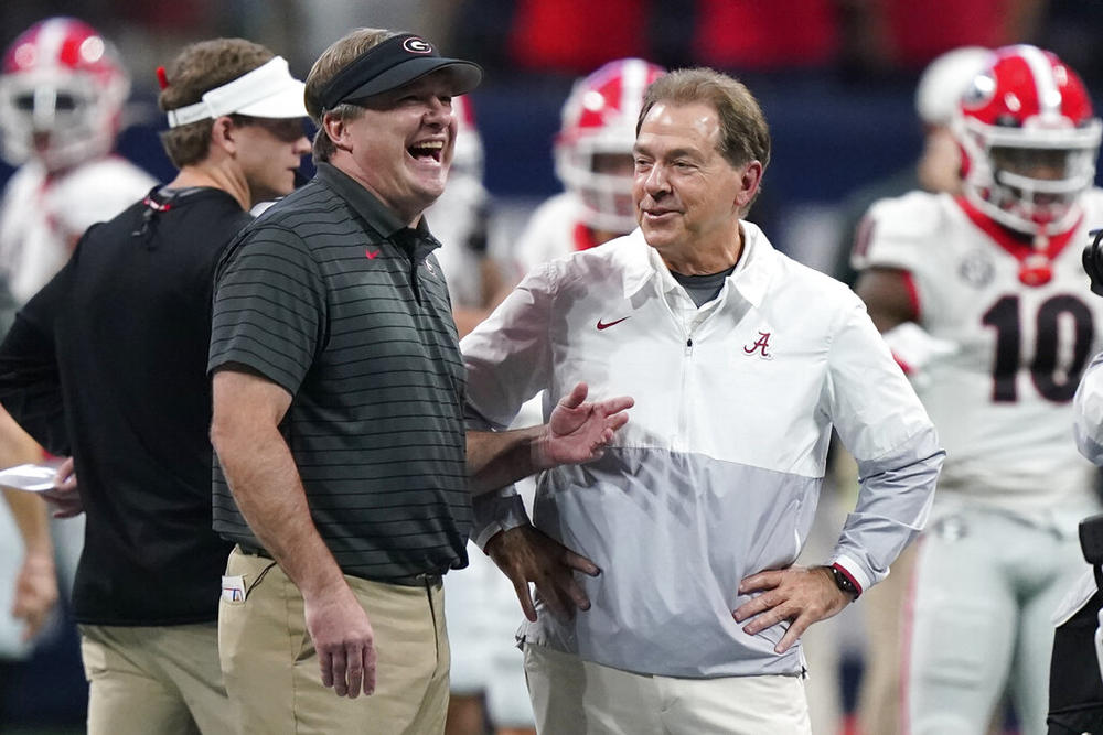 Georgia head coach Kirby Smart speaks with Alabama head coach Nick Saban before the first half of the Southeastern Conference championship NCAA college football game, Saturday, Dec. 4, 2021, in Atlanta. Georgia plays Alabama in the College Football Playoff national championship game on Jan. 10, 2022.
