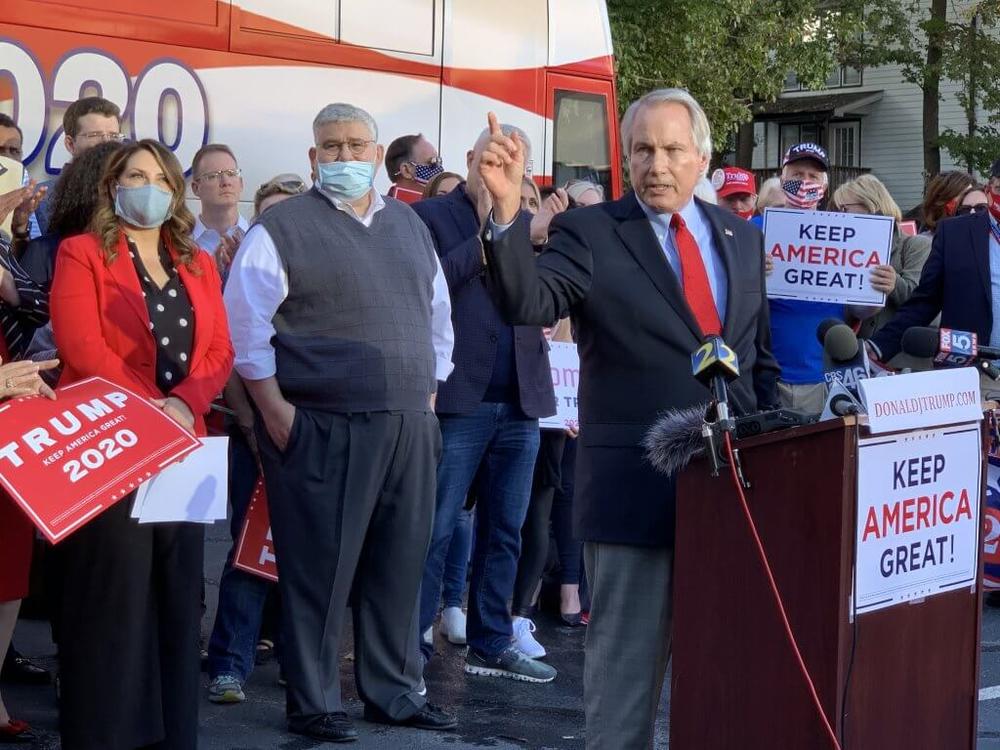 David Shafer (in vest sweater), the chairman of the Georgia Republican Party, was one of Georgia’s 16 false electors who attempted to certify the state in favor of former President Donald Trump. Shafer stood behind Trump supporter L. Lin Wood at a December 2020 Georgia rally.