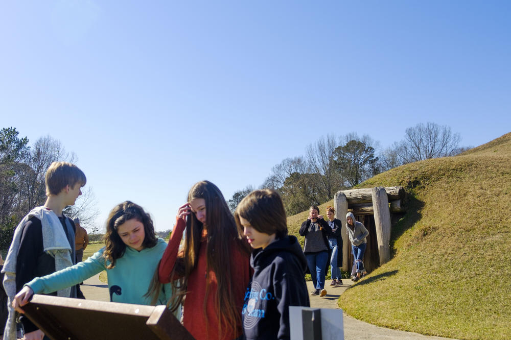 Students at the Earth Lodge at the Ocmulgee Mounds in Macon. 