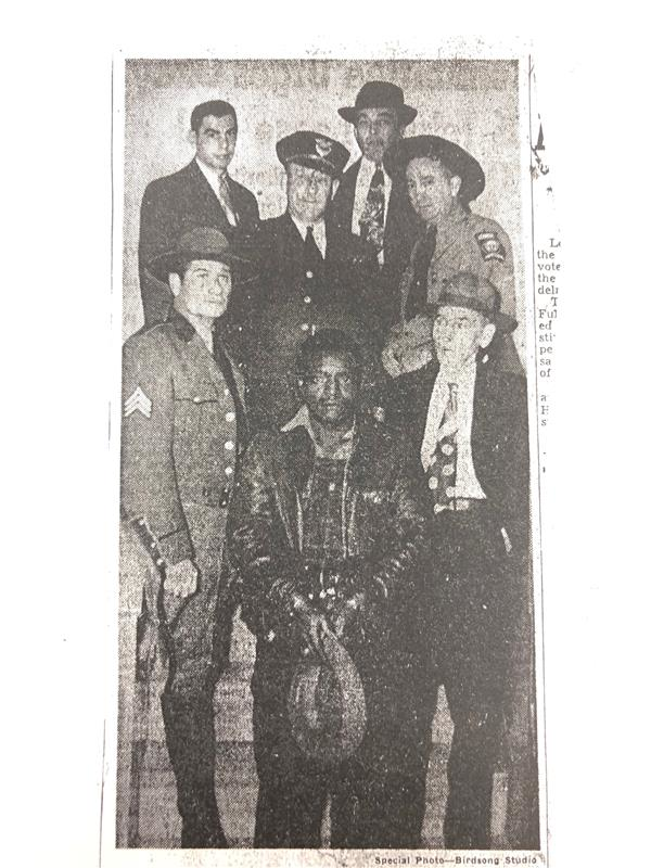 Clarence Henderson (center), apprehended in 1948 for a murder he likely did not commit.