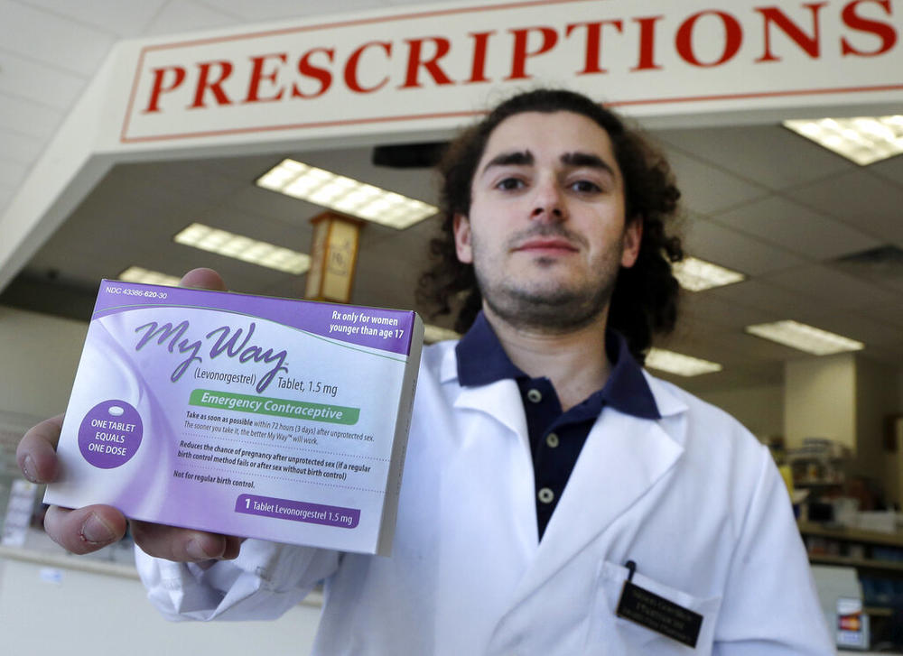 Pharmacist holds box of Plan B medication