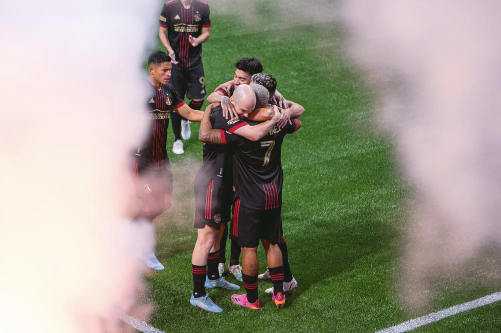 Group hug for Josef Martinez, after he scored a goal in the 2022 Opening Day match