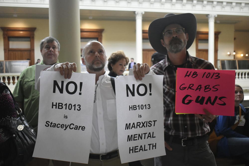 Demonstrators oppose a mental health bill.