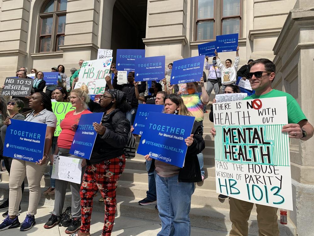 Demonstrators rally at the Georgia Capitol in support of a mental health parity bill in March 2022.