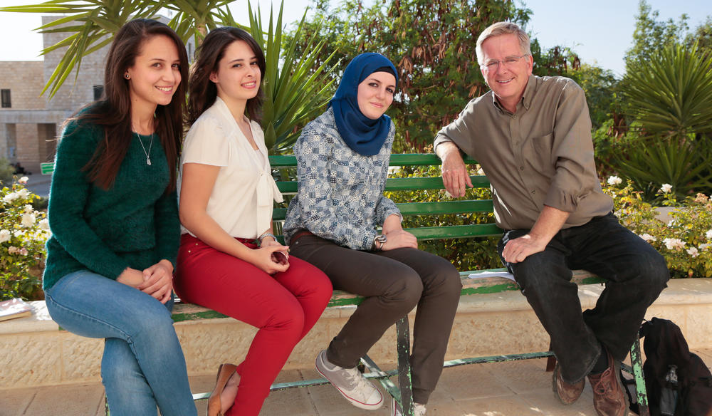Rick Steves with three female students.