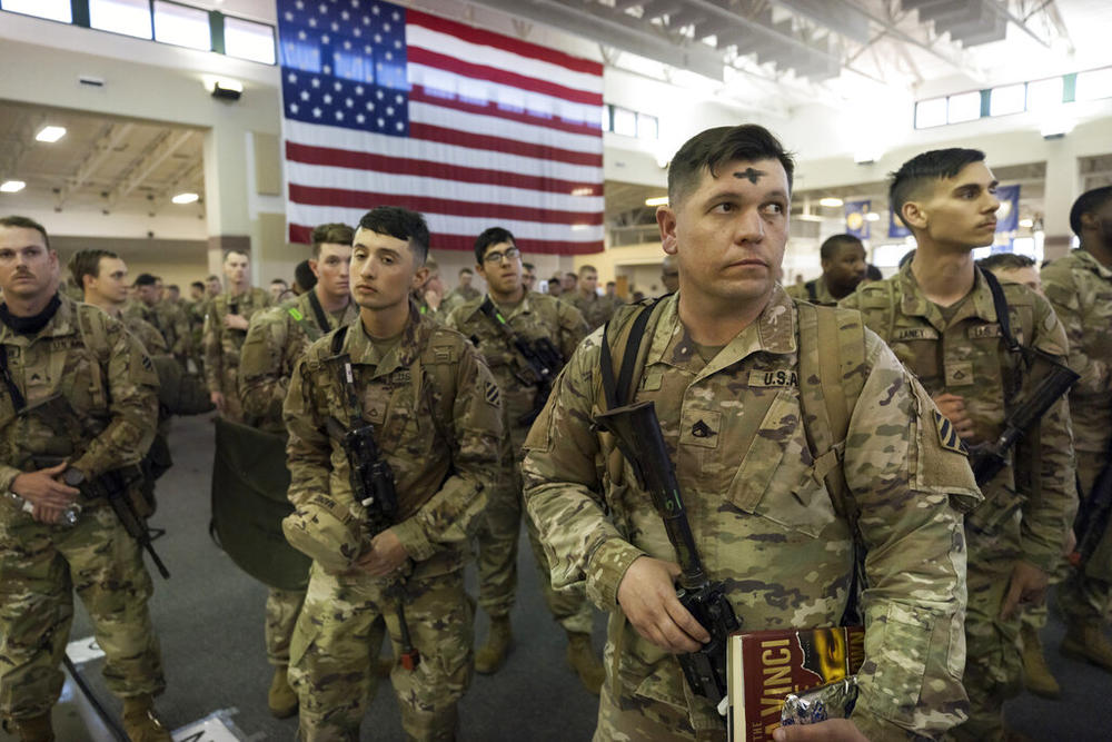 Some of the soldiers with the U.S. Army 3rd Infantry Division, 1st Armored Brigade Combat Team celebrated Ash Wednesday before being deployed to Germany from Hunter Army Airfield, Wednesday March 2, 2022 in Savannah, Ga. The division is sending 3,800 troops as reinforcements for various NATO allies in Eastern Europe.