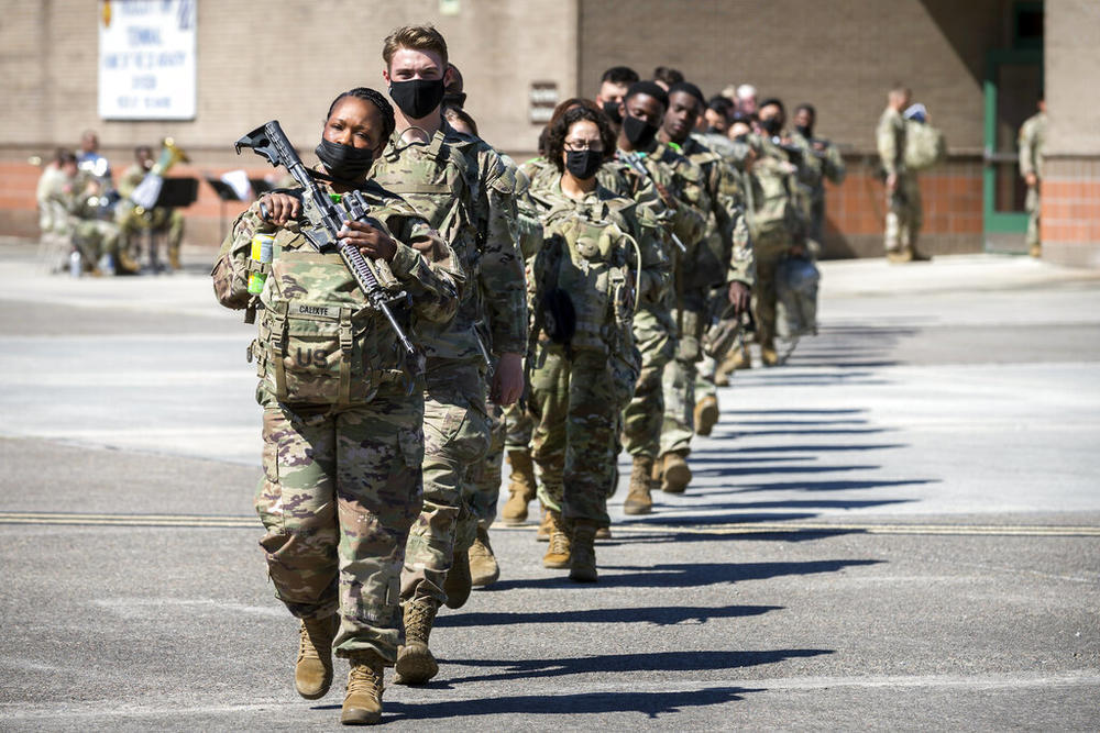 Some of the 180 soldiers with the U.S. Army 3rd Infantry Division, 1st Armored Brigade Combat Team march to a charter airplane at Hunter Army Airfield during their deployment to Germany, Wednesday March 2, 2022 in Savannah, Ga. The division is sending 3,800 troops as reinforcements for various NATO allies in Eastern Europe. 