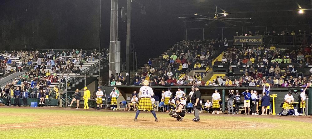 Bananas designated hitter Dakota McFadden awaits his next pitch, carefully: under the rules of Banana Ball, a batter is automatically out if he steps outside the batter's box.