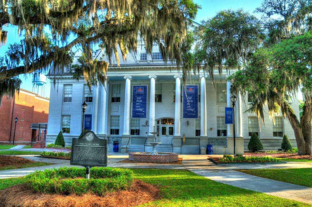 Hill Hall on the campus of Savannah State University. The building is in the classical revival architectural style, and features several pillars on the front exterior.