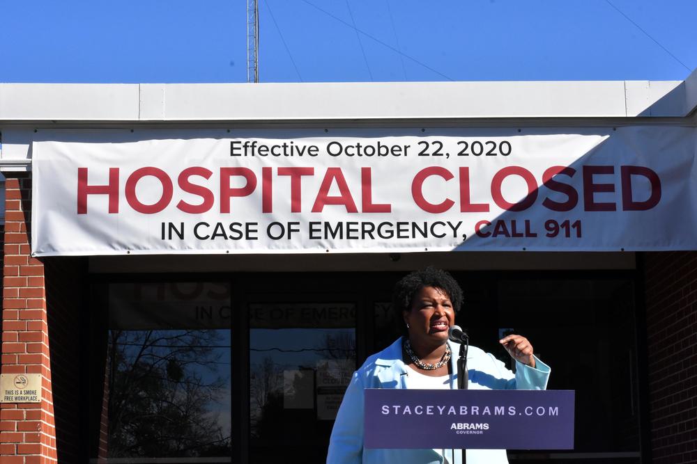 Democratic candidate for governor Stacey Abrams speaks outside a closed hospital in Cuthbert, Ga. about the need to expand the state's Medicaid coverage.