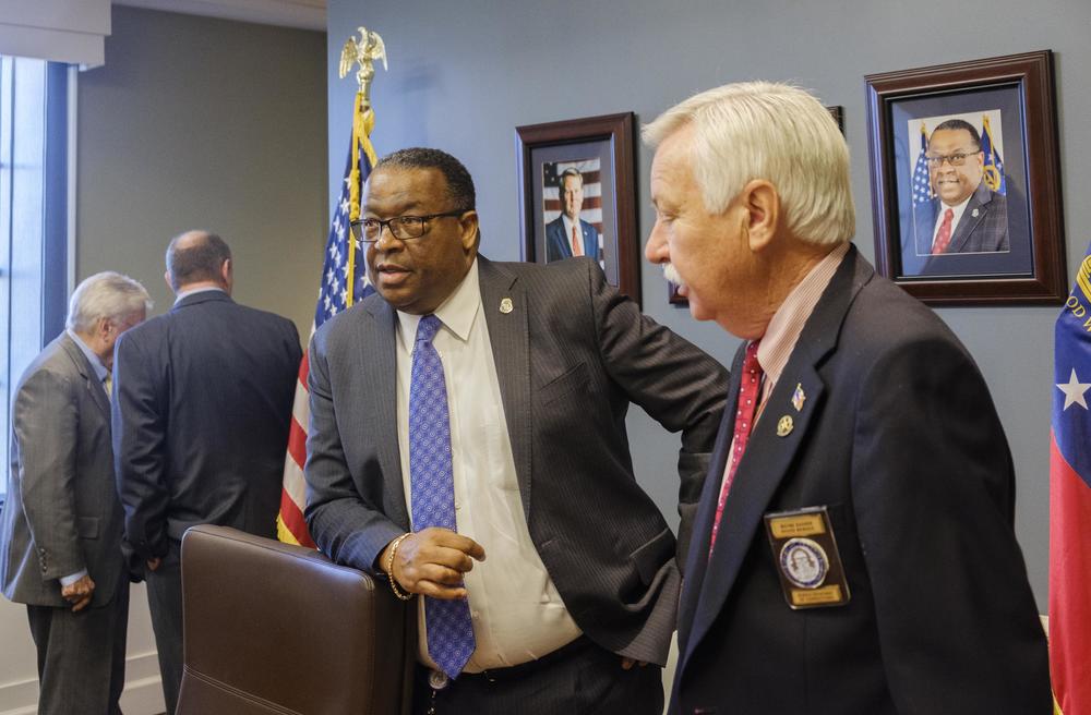 Georgia Department of Corrections Commissioner Timothy C. Ward, second from right, after the March meeting of the Board of Corrections in Forsyth. 