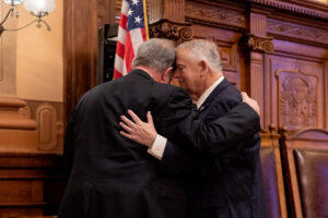 House Speaker David Ralston, right, embraces Auburn Republican Rep. Terry England after England delivered his farewell speech to legislators this session. After serving in the House since 2005, England is not seeking re-election. 