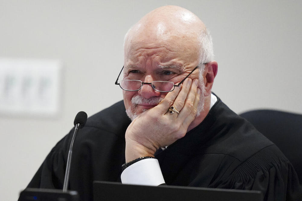 Judge Charles Beaudrot listens to arguments in the courtroom, Friday, April 22, 2022, in Atlanta. U.S. Rep. Marjorie Taylor Greene is appearing at a hearing Friday in Atlanta in a challenge filed by voters who say she shouldn't be allowed to seek reelection because she helped facilitate the attack on the Capitol that disrupted certification of Joe Biden's presidential victory.