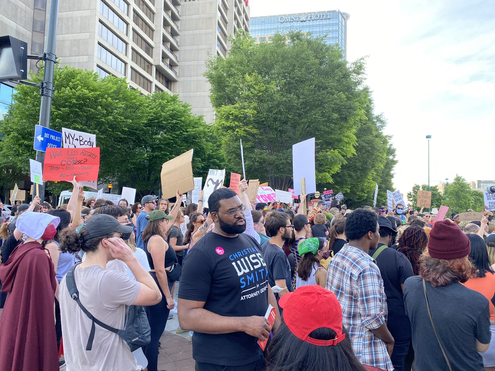 A crowd of a couple hundred people gathered at the intersection of Marietta Street and Centennial Olympic Park on May 3, 2022, to demonstrating in support of abortion access.
