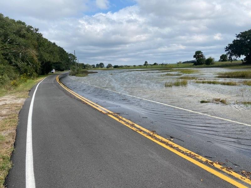 Flooding covers a road in coastal Brunswick.