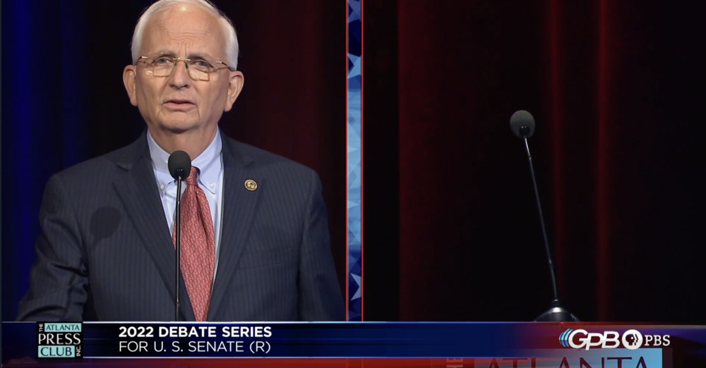 Agriculture Commissioner Gary Black debates an empty lectern representing Herschel Walker.