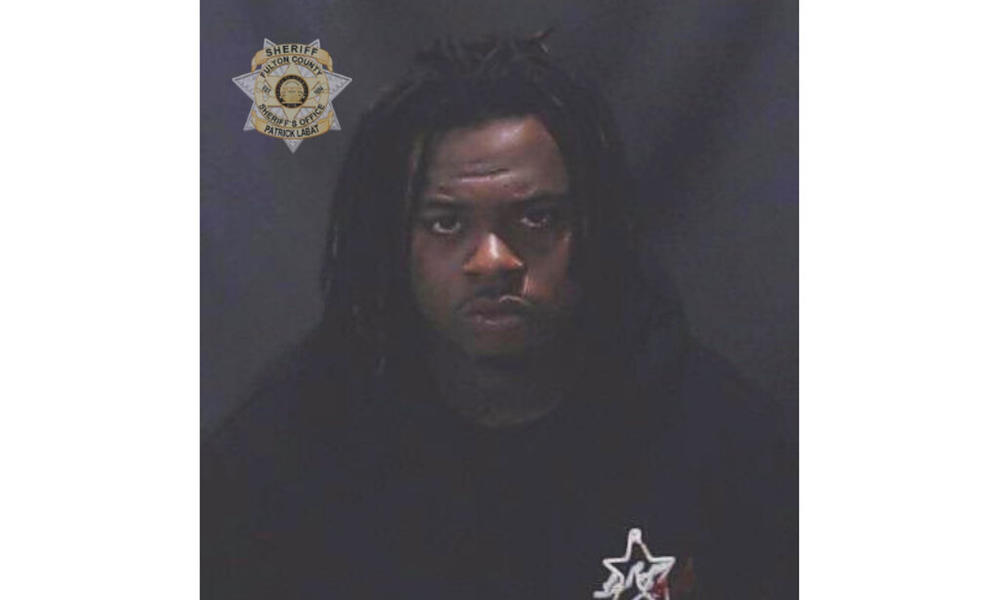 This image provided by the Fulton County Sheriff's Office shows rapper Gunna, whose given name is Sergio Kitchens. Rapper Gunna was booked into a jail in Atlanta Wednesday, May 11, 2022 on a racketeering charge after he was indicted with fellow rapper Young Thug and more than two dozen other people. An indictment filed Monday in Fulton County Superior Court accuses him of violating Georgia's anti-racketeering law. It was not immediately clear whether he had a lawyer who could comment on the charges.