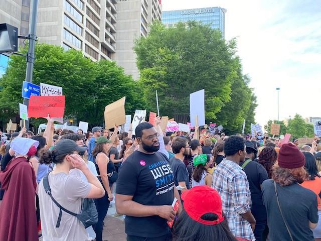 A crowd gathers at the intersection of Marietta Street and Centennial Olympic Park to demonstrate in support of access to abortion.
